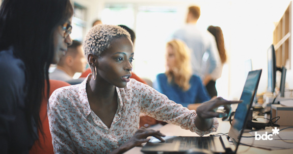 woman on her computer looking for the right software for her