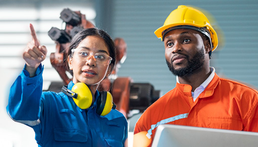 Female engineer presenting welding process to her male colleague