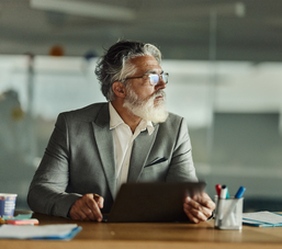 Mature entrepreneur with laptop