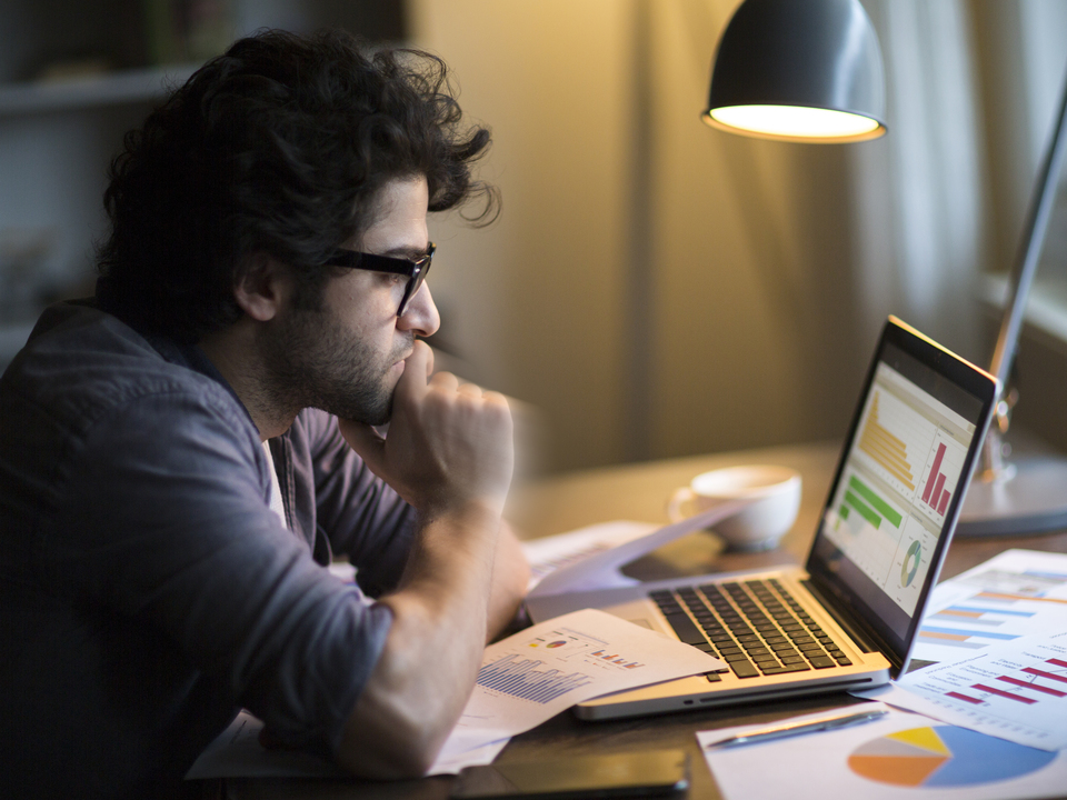 Man on his computer working on marketing, sales and export