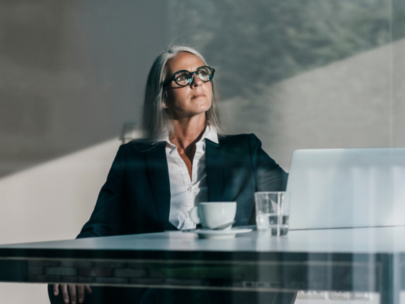 businesswoman at desk with laptop